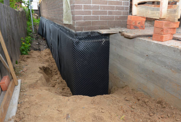 Happy homeowners after waterproofing job in New Madison
